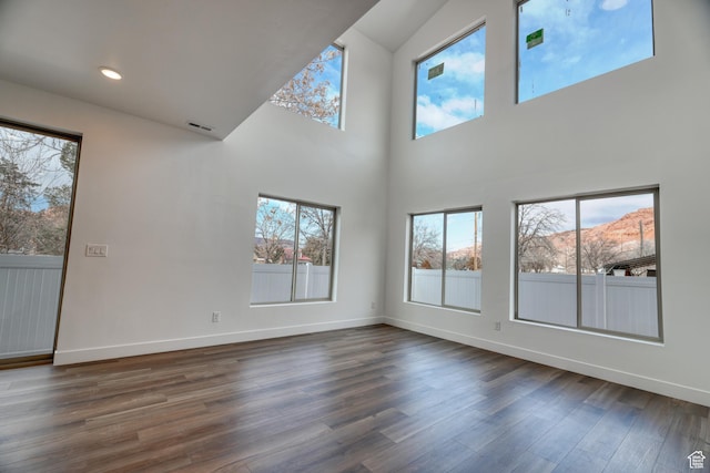 241 E 100 N Unit 4, Moab, UT 84532 - unfurnished living room featuring a mountain view and dark hardwood / wood-style flooring