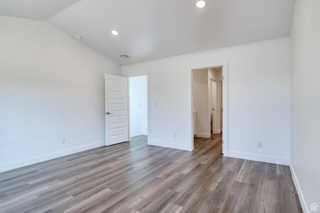 241 E 100 N Unit 4, Moab, UT 84532 - unfurnished bedroom featuring wood-type flooring and lofted ceiling
