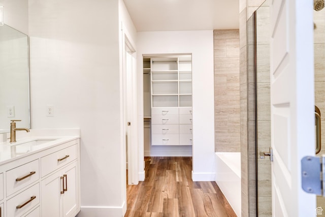 241 E 100 N Unit 4, Moab, UT 84532 - bathroom with hardwood / wood-style flooring, vanity, and independent shower and bath