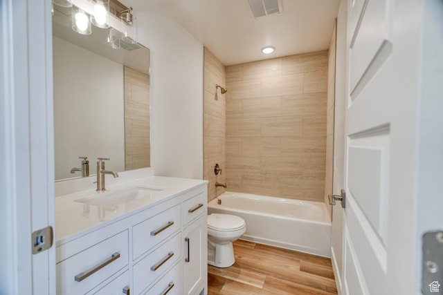 241 E 100 N Unit 4, Moab, UT 84532 - full bathroom with tiled shower / bath, vanity, toilet, and hardwood / wood-style floors