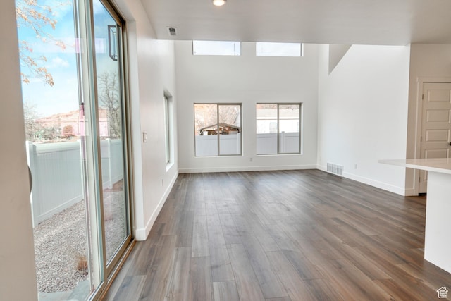 241 E 100 N Unit 4, Moab, UT 84532 - unfurnished living room with dark hardwood / wood-style flooring