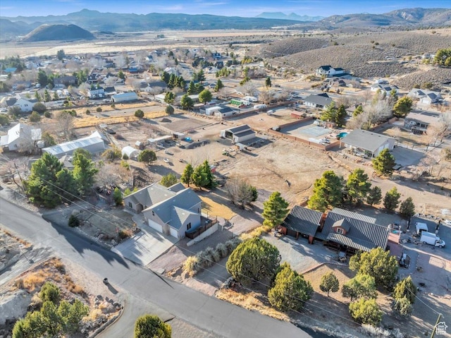 birds eye view of property with a mountain view