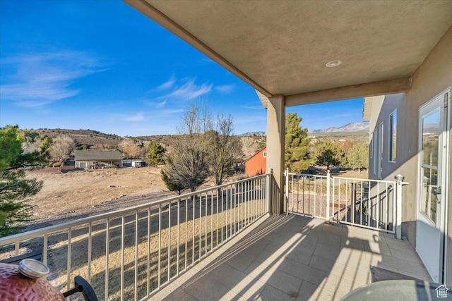 balcony featuring a mountain view
