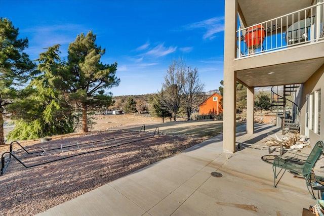 view of patio with a balcony