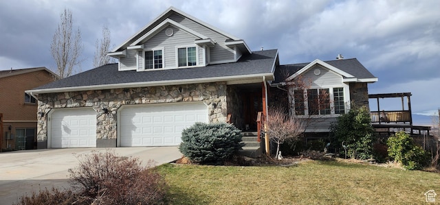 view of front of property featuring a garage and a front lawn