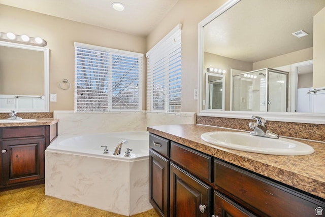 700 S Clearwater Falls Dr E, Layton, UT 84041 - bathroom with tile patterned floors, vanity, and shower with separate bathtub