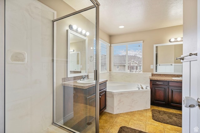 700 S Clearwater Falls Dr E, Layton, UT 84041 - bathroom featuring independent shower and bath, vanity, tile patterned floors, and a textured ceiling