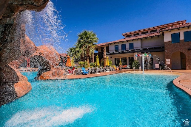 3780 Arcadia Dr Unit 51, Santa Clara, UT 84765 - view of swimming pool featuring a patio and pool water feature