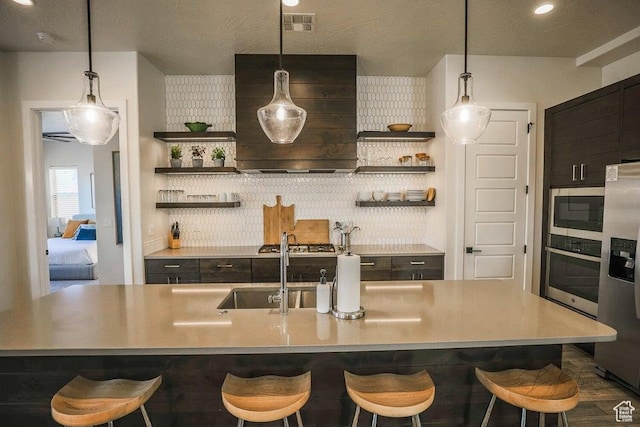 3780 Arcadia Dr Unit 51, Santa Clara, UT 84765 - kitchen with appliances with stainless steel finishes, a kitchen breakfast bar, and sink