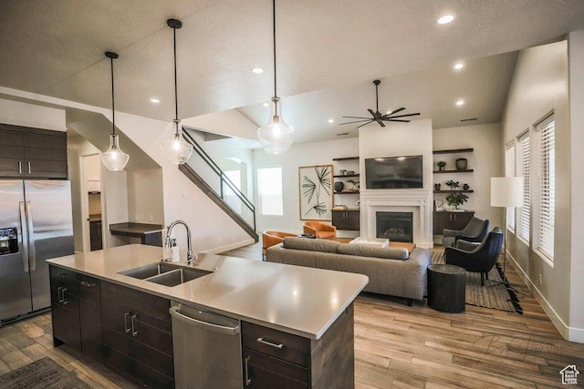 3780 Arcadia Dr Unit 51, Santa Clara, UT 84765 - kitchen with stainless steel appliances, an island with sink, sink, and decorative light fixtures