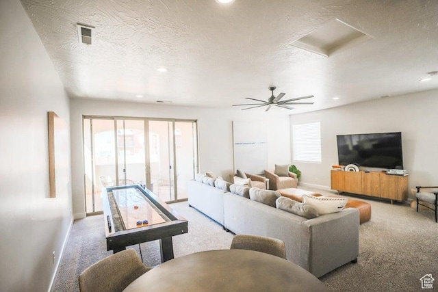 3780 Arcadia Dr Unit 51, Santa Clara, UT 84765 - carpeted living room featuring ceiling fan and a textured ceiling