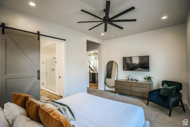3780 Arcadia Dr Unit 51, Santa Clara, UT 84765 - carpeted bedroom featuring ceiling fan, ensuite bathroom, and a barn door