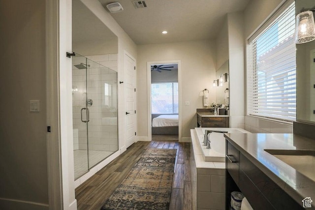 3780 Arcadia Dr Unit 51, Santa Clara, UT 84765 - bathroom featuring ceiling fan, wood-type flooring, shower with separate bathtub, and vanity