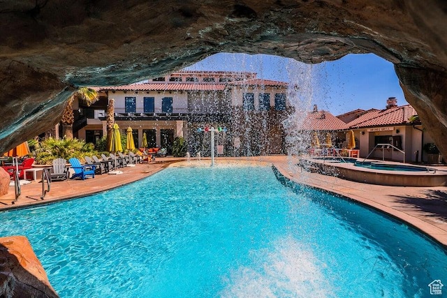 3780 Arcadia Dr Unit 51, Santa Clara, UT 84765 - view of swimming pool with pool water feature and a community hot tub