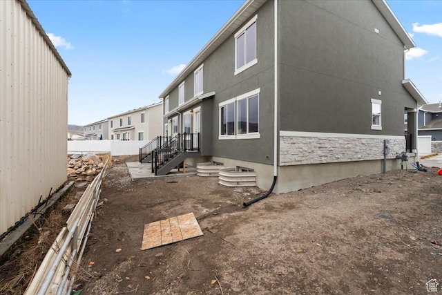 view of side of property with fence