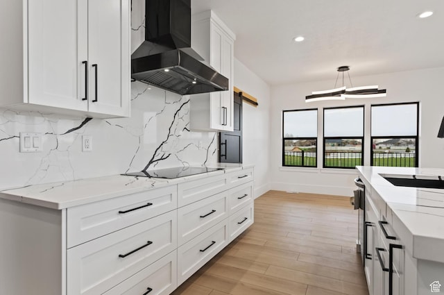 124 E 4100 N, North Ogden, UT 84414 - kitchen featuring pendant lighting, white cabinets, light stone countertops, and wall chimney range hood