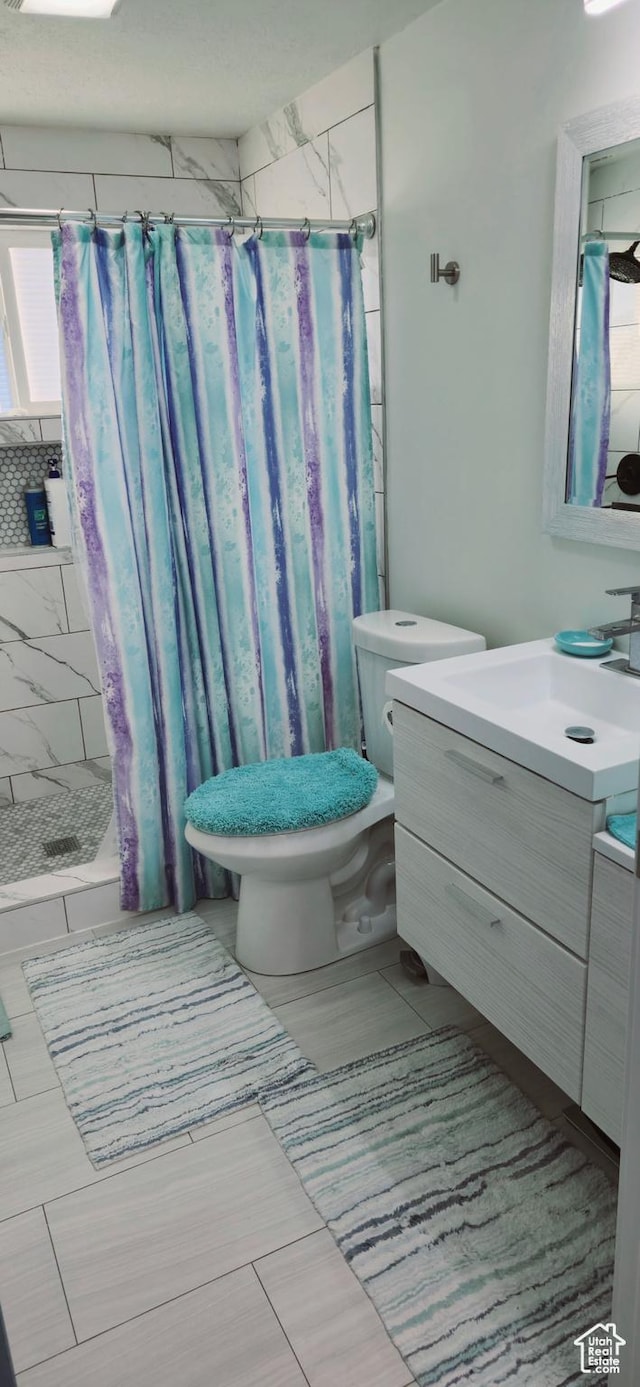 1600 W 4300 S, Salt Lake City, UT 84123 - bathroom featuring vanity, toilet, and a stall shower