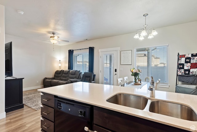2390 W Jade Way Unit 2, West Haven, UT 84401 - kitchen with light countertops, open floor plan, a sink, dark brown cabinets, and black appliances