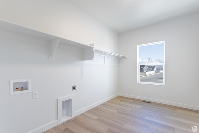 3047 N 2875 W Unit 7, Plain City, UT 84404 - laundry room featuring hookup for a washing machine, light wood-style floors, hookup for an electric dryer, and baseboards