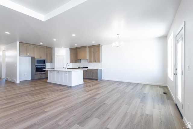 3047 N 2875 W Unit 7, Plain City, UT 84404 - kitchen with stainless steel appliances, open floor plan, a chandelier, a sink, and recessed lighting