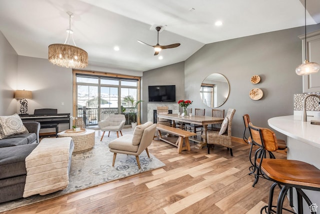 14084 N Council Fire Trl Unit 14D, Kamas, UT 84036 - living room with ceiling fan with notable chandelier, lofted ceiling, sink, and light hardwood / wood-style floors