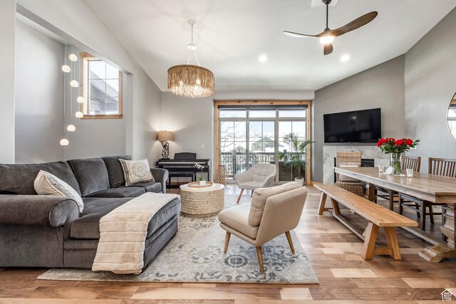 14084 N Council Fire Trl Unit 14D, Kamas, UT 84036 - living room with ceiling fan with notable chandelier and light hardwood / wood-style floors