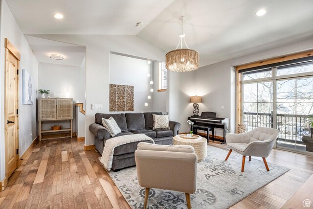 14084 N Council Fire Trl Unit 14D, Kamas, UT 84036 - living room featuring vaulted ceiling, an inviting chandelier, and light hardwood / wood-style floors
