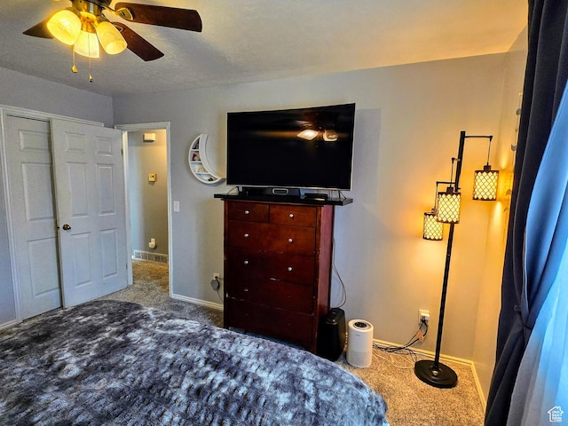 carpeted bedroom featuring ceiling fan