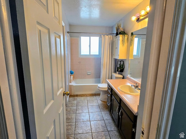 full bathroom featuring shower / bath combo, vanity, tile patterned floors, and toilet