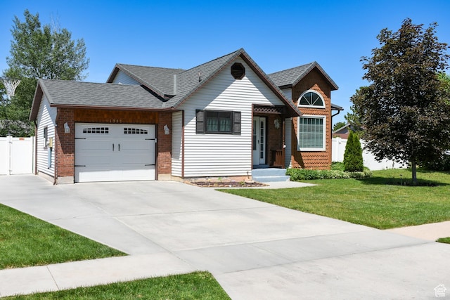 1797 N 700th St E, North Ogden, UT 84414 - view of front of home featuring an attached garage, driveway, and roof with shingles