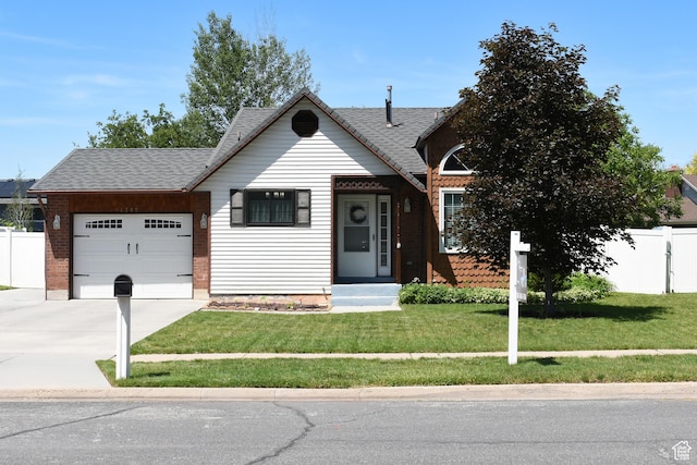 1797 N 700th St E, North Ogden, UT 84414 - view of front of house featuring a garage, driveway, and roof with shingles