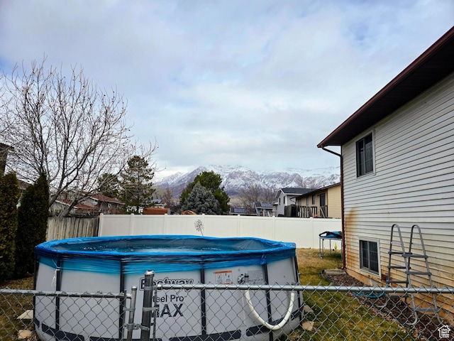 view of pool with a mountain view