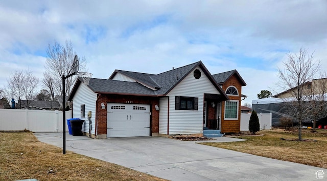 view of front facade featuring a garage and a front yard