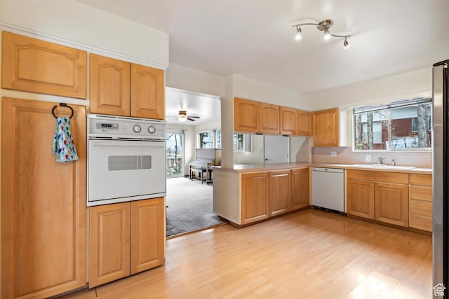 1320 Country Hills Dr, Ogden, UT 84403 - kitchen with sink, white appliances, kitchen peninsula, and a healthy amount of sunlight