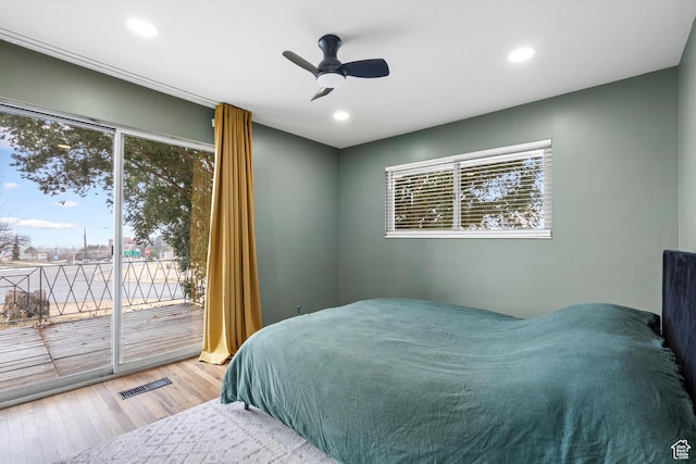 1320 Country Hills Dr, Ogden, UT 84403 - bedroom with wood-type flooring, access to outside, and ceiling fan