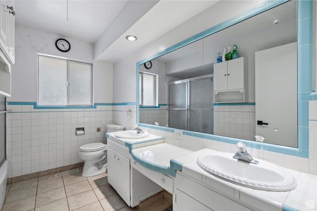 1320 Country Hills Dr, Ogden, UT 84403 - bathroom featuring tile patterned flooring, vanity, tile walls, and toilet