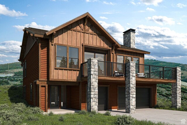 view of front facade with a garage and a balcony