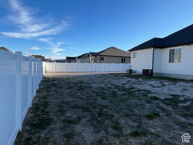 view of yard with a fenced backyard