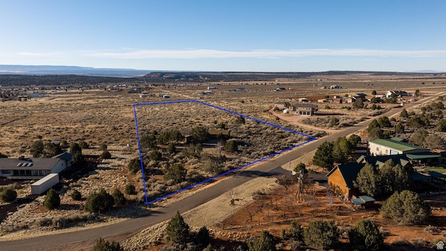 drone / aerial view featuring a rural view and a mountain view