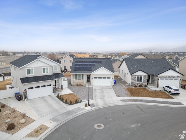 view of front facade featuring solar panels