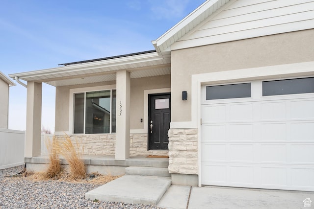 property entrance featuring a porch and a garage