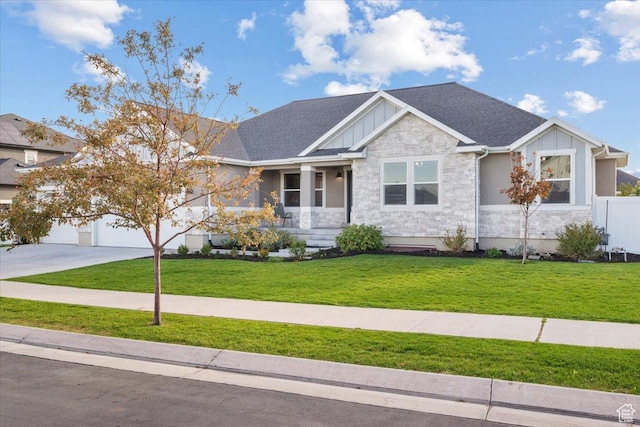 view of front facade featuring a garage and a front lawn
