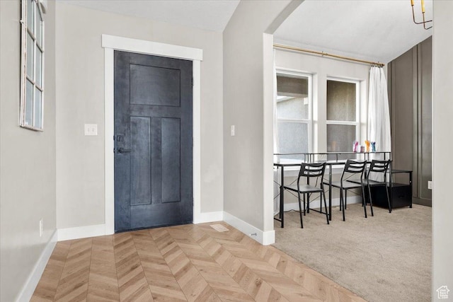 foyer featuring light parquet flooring