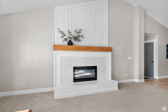 unfurnished living room featuring lofted ceiling and light carpet