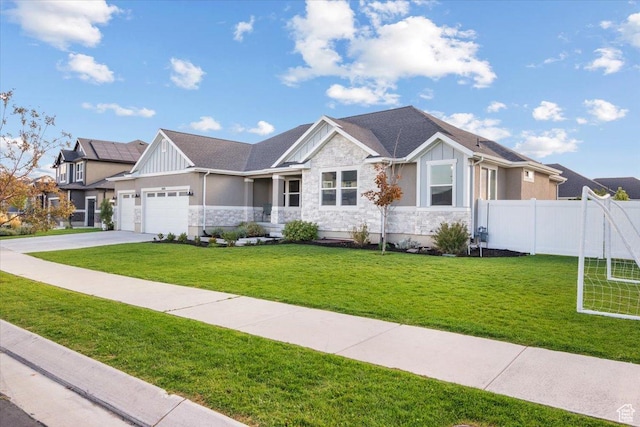 view of front of house with a garage and a front lawn