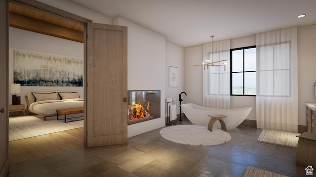 460 E Big Dutch Dr, Heber City, UT 84032 - bathroom with a tub to relax in and a notable chandelier