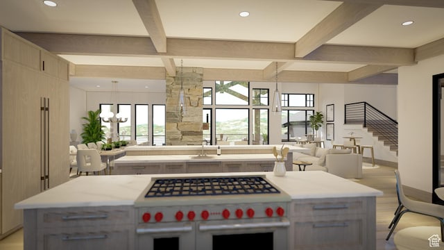 460 E Big Dutch Dr, Heber City, UT 84032 - kitchen with sink, double oven range, beam ceiling, a notable chandelier, and a center island with sink