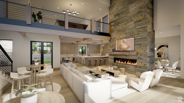 460 E Big Dutch Dr, Heber City, UT 84032 - living room with a towering ceiling, a fireplace, and light hardwood / wood-style floors