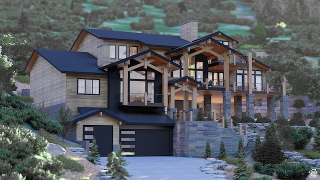 view of front facade featuring a balcony and a garage