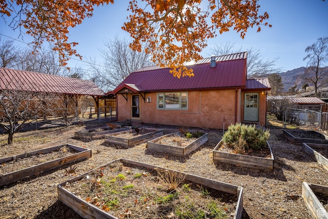 back of property featuring a mountain view
